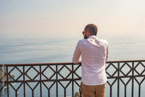 man looking at the sea