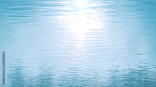 water surface with ripples and waves. sun glare. aquatic background. tinted