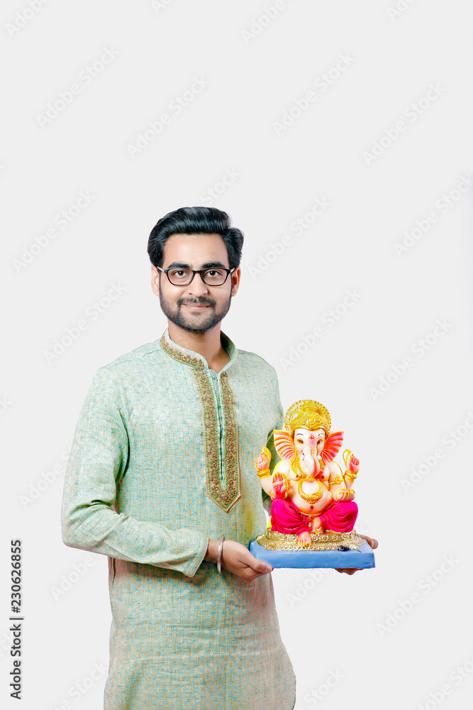 Young Indian man with Lord Ganesha , Celebrating Ganesh festival Young Indian man with Lord Ganesha , Celebrating Ganesh festival