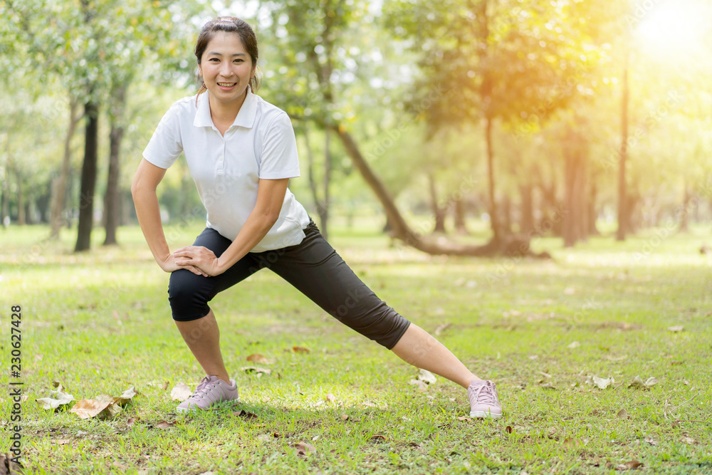 young asian woman jogging or exercise in green park .sporty woman concept. young asian woman jogging or exercise in green park .sporty woman concept.