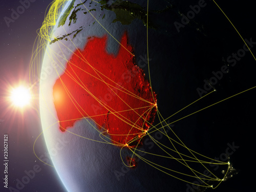 Australia from space on model of Earth during sunset with international network. Concept of digital communication or travel.