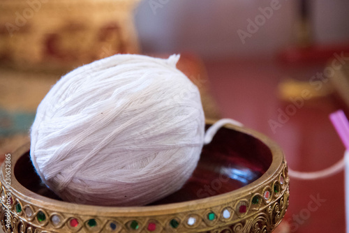 White holy thread roll is placed to a religious ceremony