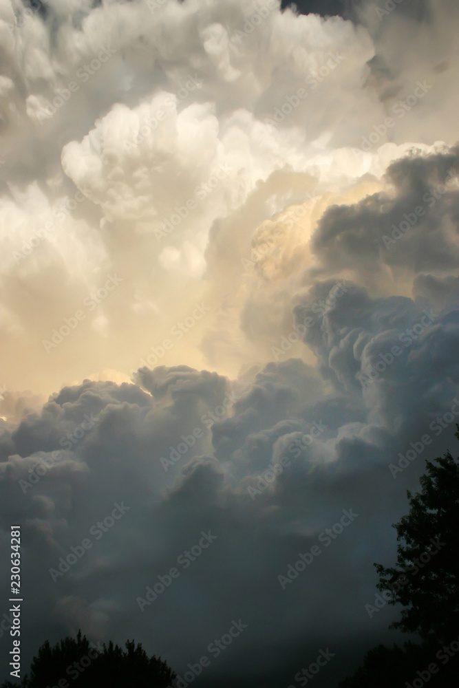 These dark and dramatic thunderstorm clouds developed directly overhead on a hot and humid Kansas summer afternoon. A tornado warning soon followed. These dark and dramatic thunderstorm clouds developed directly overhead on a hot and humid Kansas summer afternoon. A tornado warning soon followed.