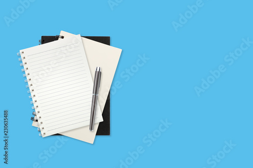 workspace business table with office supplies on blue pastel background