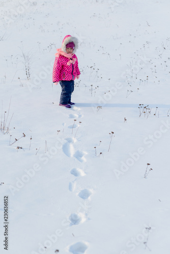 Little girl and snow..