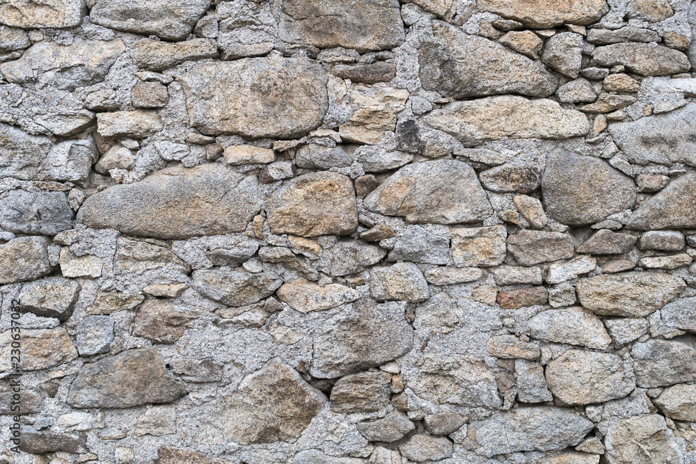Stone masonry backgrounds, Modern retro wall in interior texture, Retaining masonry of different size stone Stone masonry backgrounds, Modern retro wall in interior texture, Retaining masonry of different size stone