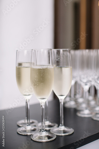 elegant glasses of champagne on table