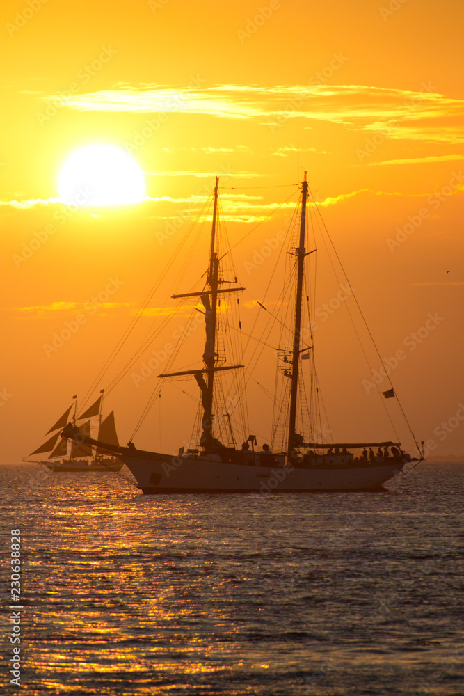 Beautiful sunset and sailboats at Mallory Square Pier in Key West Florida