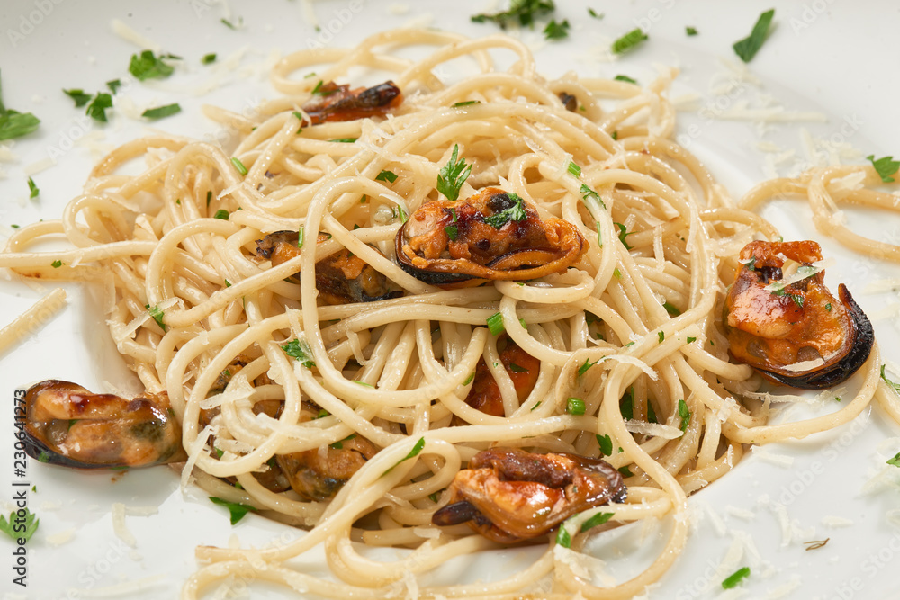 clams spaghetti on white ceramic plate clams spaghetti on white ceramic plate