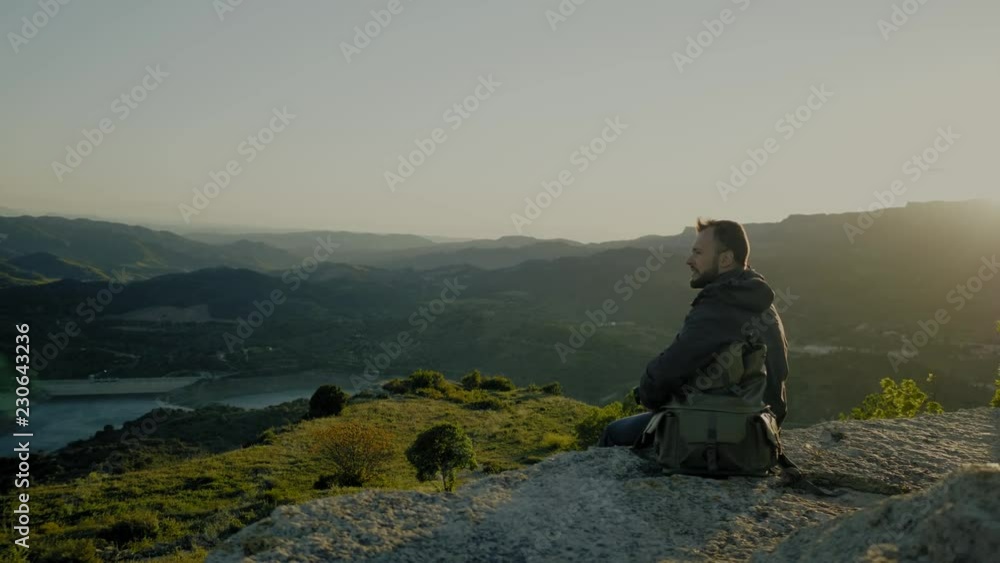 Photographer standing on top of mountain Photographer standing on top of mountain