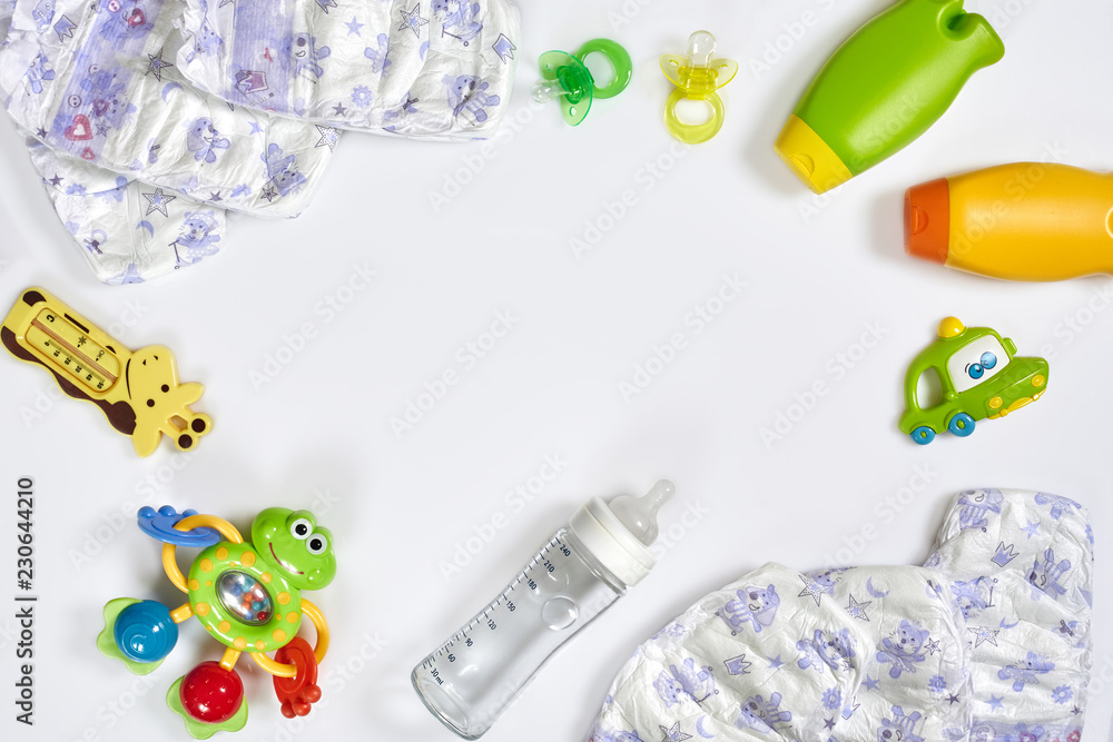 Set of accessories for baby. Pacifier, bottle, diaper, cream on white background. Set of accessories for baby. Pacifier, bottle, diaper, cream on white background.