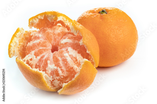 peeled mandarin juicy slices on white background
