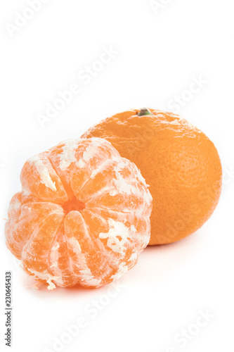 peeled mandarin juicy slices on white background