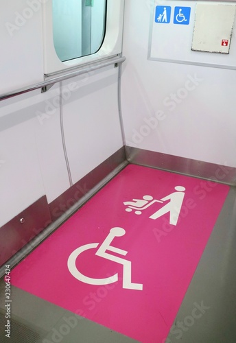 The sign of area for disabled and baby stroller in railways. Universal design in Japan. Sign and transportation concept.