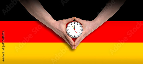 Angela Merkel diamond hand gesture with german flag photo