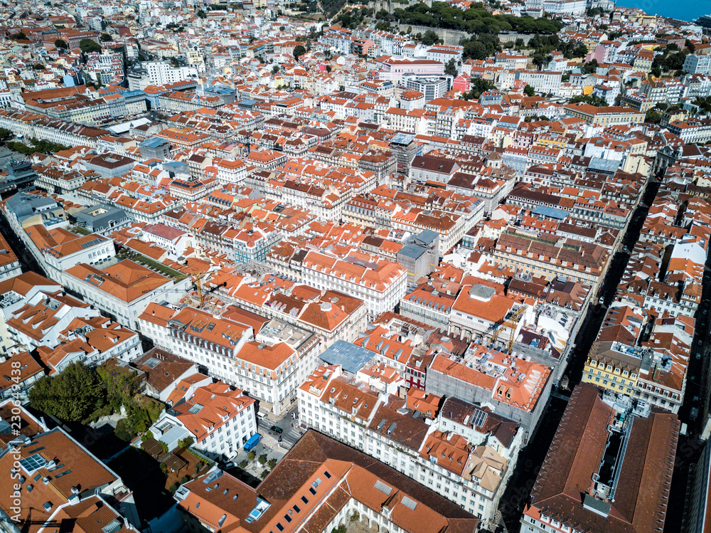 Aerial drone panorama photo - Colorful orange roofs of the Alfama district & the Comercio Square (Praça do Comércio) of Lisbon Portugal