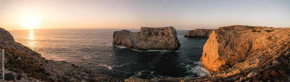 Rugged cliffs of the coastline of Cape St. Vincent at sunset. Near Lagos, Algarve region of Portugal. Rugged cliffs of the coastline of Cape St. Vincent at sunset. Near Lagos, Algarve region of Portugal.