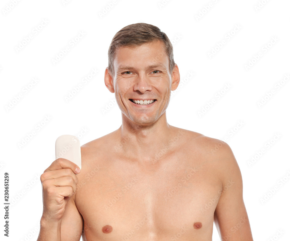 Portrait of man holding soap bar on white background Portrait of man holding soap bar on white background