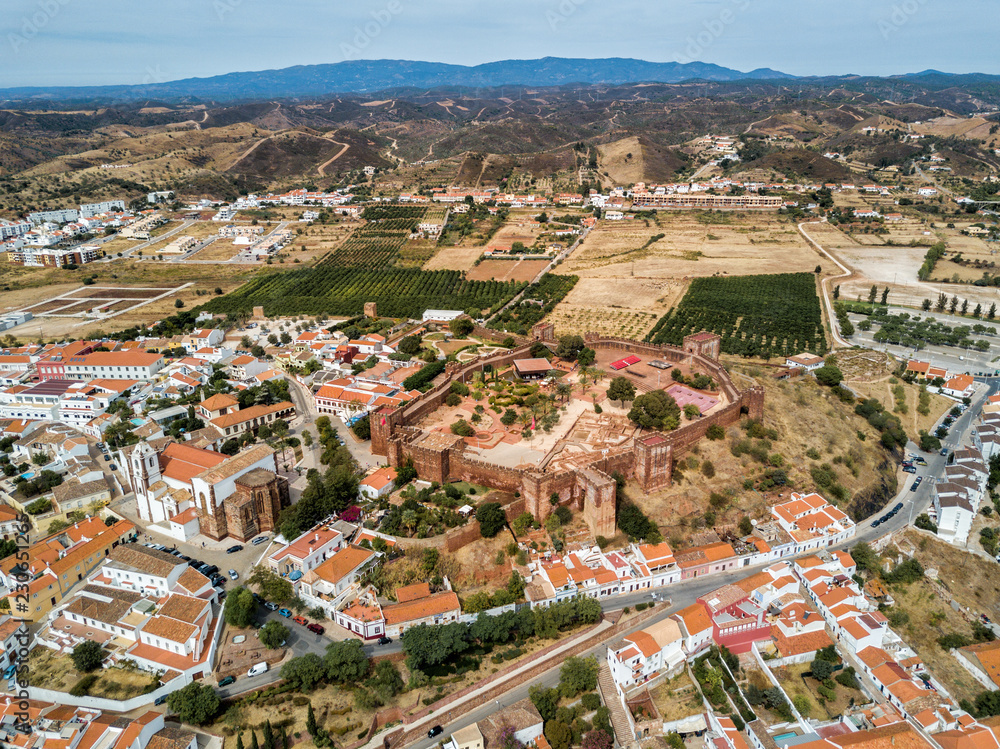 Aerial drone photograph of the Silves Castle.  A medieval fortress built by the Moorish empire/caliphate in the Algarve region of Portugal.  
