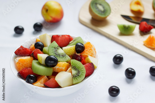 Fresh salad with various fruits. Healthy lifestyle.