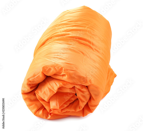 Rolled sleeping bag on white background. Camping equipment