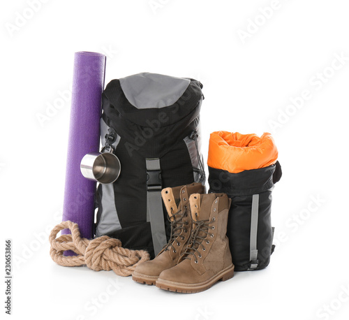 Set of camping equipment with sleeping bag on white background