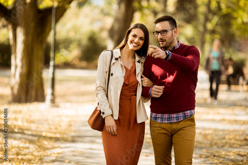Young woman and man walking...