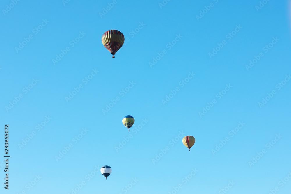 Obraz premium Colorful hot air balloons flying in blue sky