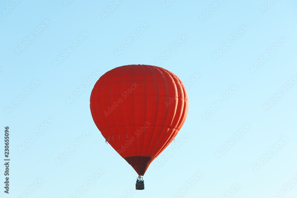 Obraz premium Colorful hot air balloon flying in blue sky