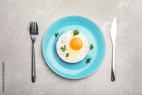Fried sunny side up egg served on table  flat lay