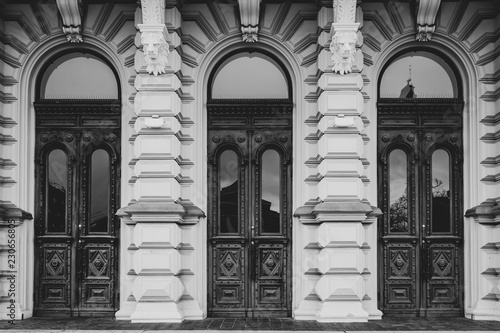 Three wooden doors in black and white