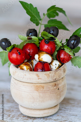 Tomato cherry and mozzarella skewers with modena vinegar