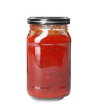 Tasty homemade tomato sauce in glass jar on white background