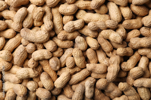 Dry peanuts in shell as background, top view. Healthy snack
