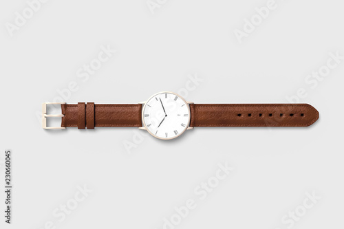 Brown leather watch for men isolated on soft gray background.