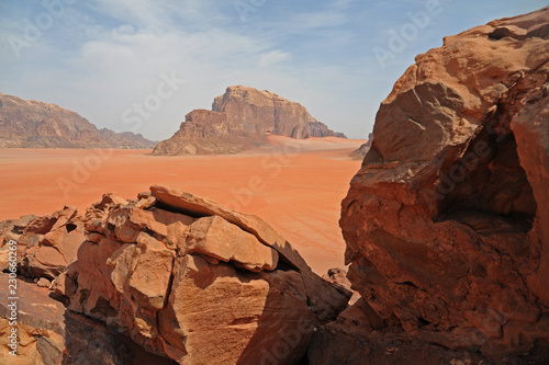Red mountains of the canyon of Wadi Rum desert in Jordan. Wadi Rum also known as The Valley of the Moon is a valley cut into the sandstone and granite rock in southern Jordan to the east of Aqaba © porpendero