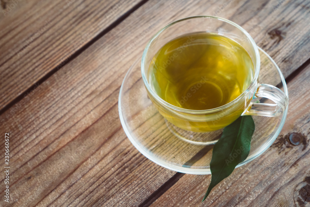 cup of tea on a wooden table. cup of tea on a wooden table.
