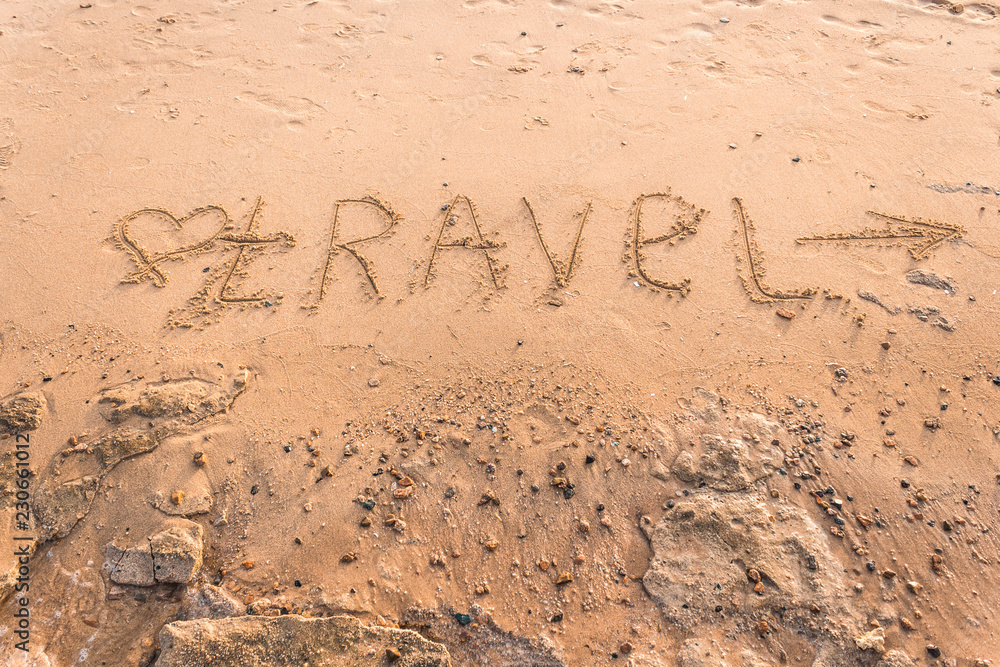 Fototapeta premium Summer drawn letters on a sandy beach. Text template pattern. Creative typography for holiday greetings.