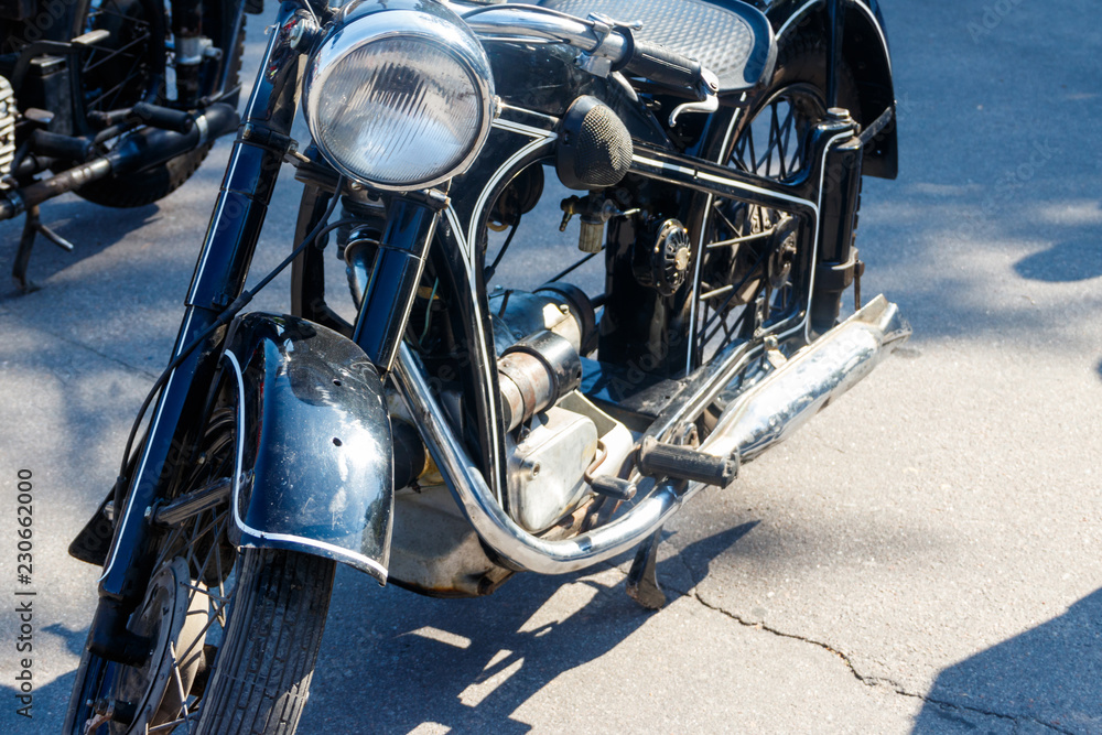 Obraz premium Close-up of motorcycle parked on city street
