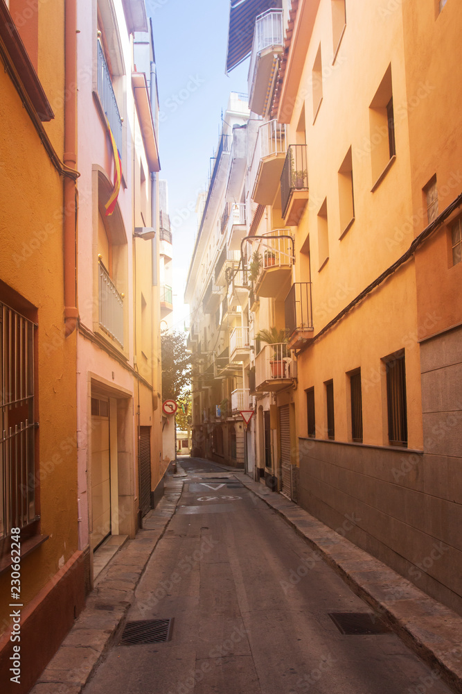 Narrow street of Blanes, Costa Brava, Spain. Catalan streets. Spanish town of Blanes