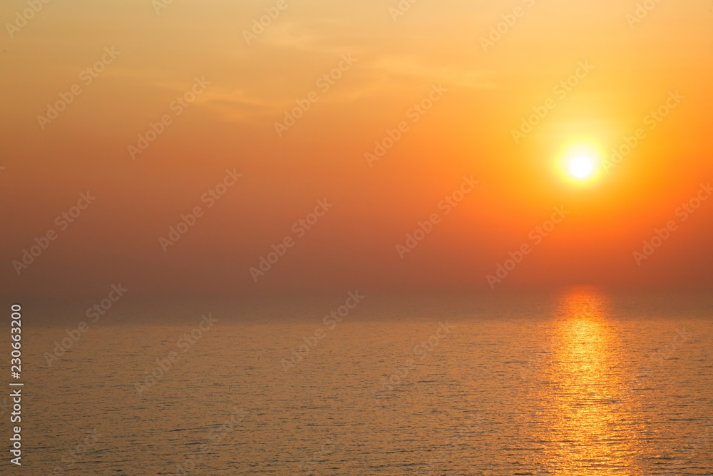 horizontal view of Sunset golden light reflecting on sea wave ripple surface background. Abstract, tranquility, serenity, romance, refresh, relaxation, rest, beauty in nature concept.