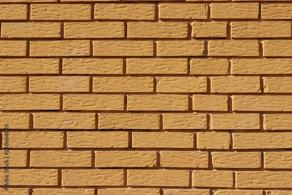 Yellow painted brick wall Yellow painted brick wall