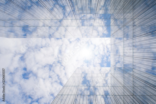glass facade of a modern building reflecting clouds