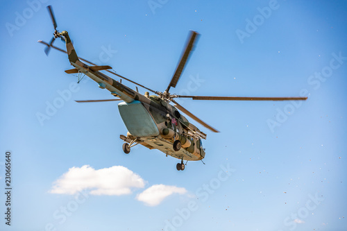 Fototapeta Naklejka Na Ścianę i Meble -  military helicopter flying during exercise performing a military demonstration