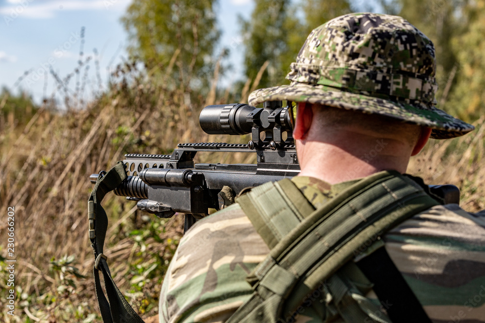 special forces, soldier assault rifle with silencer, optical sight ...