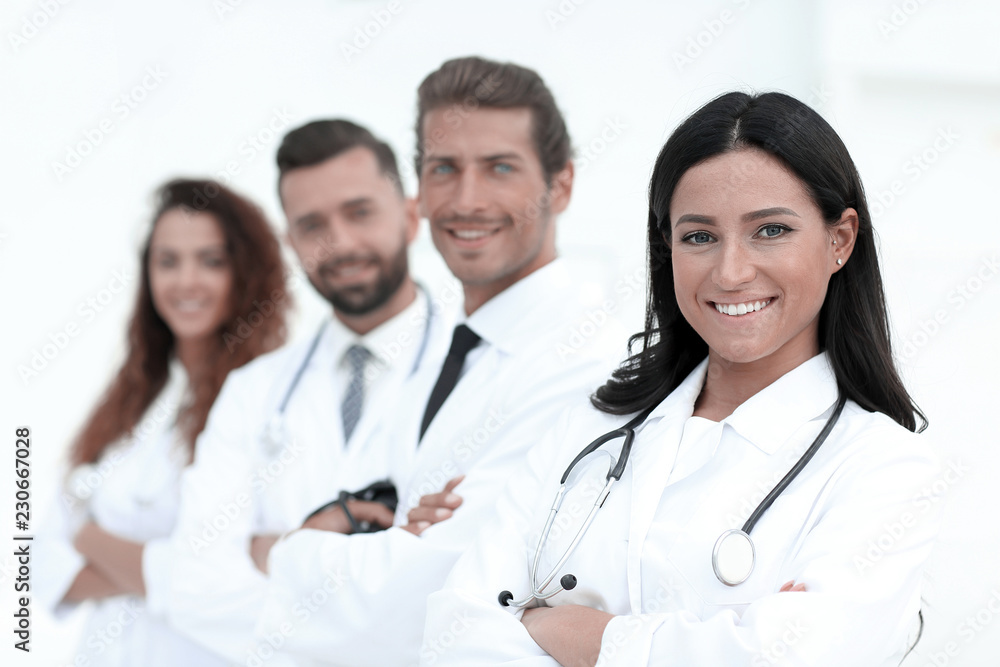 woman doctor on the background of colleagues woman doctor on the background of colleagues
