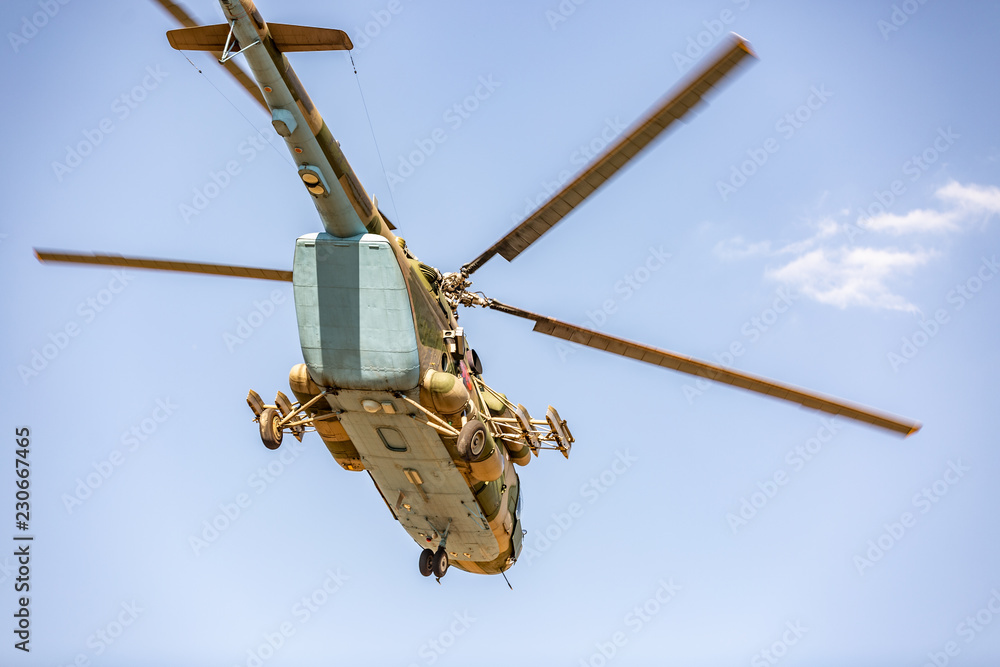 military helicopter flying during exercise performing a military demonstration