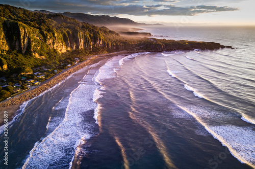Aerial view of beautiful sunset at Punakaiki beach in New Zealand