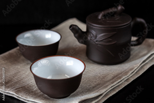 Chinese brown teapot and cups for tea