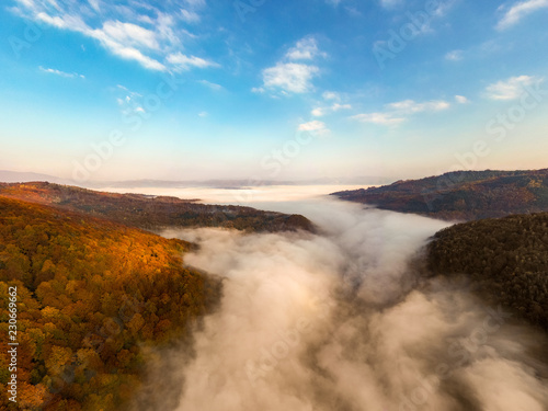 Foggy morning panorama in Jiului Canyon Transylvania Romania photo